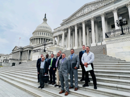 men in suits standing at capitol hill