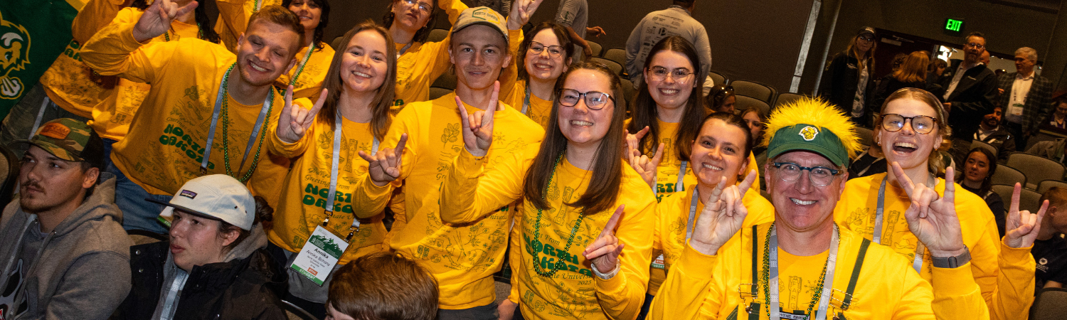group of college students posing and smiling for the camera